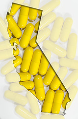 Image showing Outline map of Austria with transparent pills in background