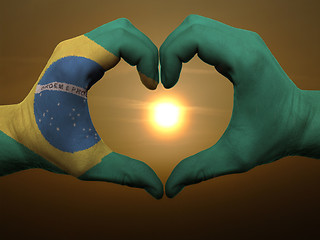 Image showing Heart and love gesture by hands colored in brazil flag during be