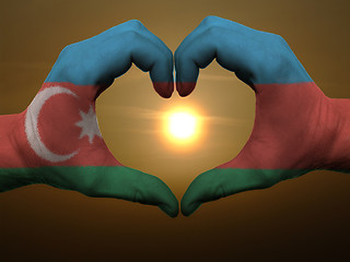 Image showing Heart and love gesture by hands colored in azerbaijan flag durin