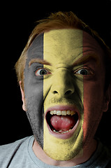 Image showing Face of crazy angry man painted in colors of Belgium flag