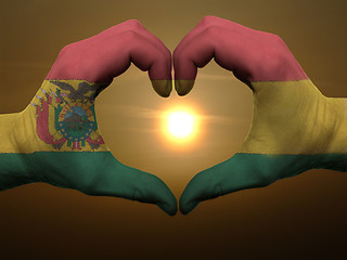 Image showing Heart and love gesture by hands colored in bolivia flag during b