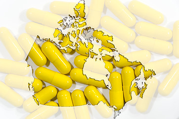 Image showing Map of Canada with capsules in background