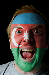 Image showing Face of crazy angry man painted in colors of azerbaijan flag