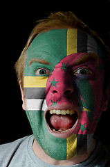 Image showing Face of crazy angry man painted in colors of dominica flag