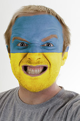 Image showing Face of crazy angry man painted in colors of Ukraine flag