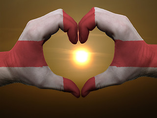 Image showing Heart and love gesture by hands colored in england flag during b