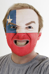 Image showing Face of crazy angry man painted in colors of chile flag