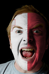 Image showing Face of crazy angry man painted in colors of malta flag