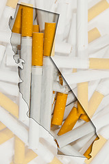 Image showing Outline map of California with transparent cigarettes in backgro