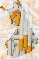 Image showing Map of Finland with cigarettes in background