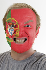 Image showing Face of crazy angry man painted in colors of portugal flag