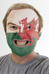 Image showing Face of crazy angry man painted in colors of wales flag