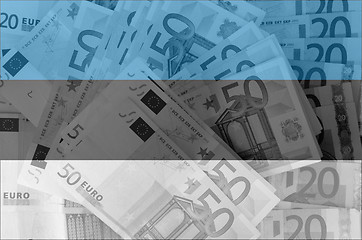 Image showing flag of Estonia with transparent euro banknotes in background 