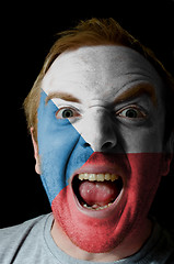 Image showing Face of crazy angry man painted in colors of czech flag