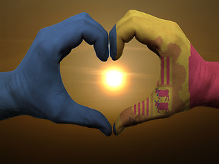 Image showing Heart and love gesture by hands colored in andora flag during be