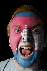 Image showing Face of crazy angry man painted in colors of Cambodia flag