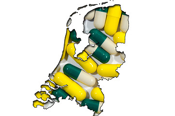 Image showing Outline map of Netherlands with pills in background