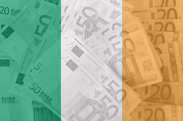 Image showing flag of Ireland with transparent euro banknotes in background 
