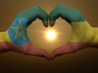 Image showing Heart and love gesture by hands colored in ethiopia flag during 