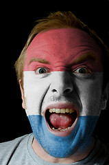 Image showing Face of crazy angry man painted in colors of holland flag