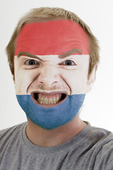 Image showing Face of crazy angry man painted in colors of holland flag