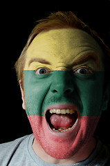 Image showing Face of crazy angry man painted in colors of lithuania flag