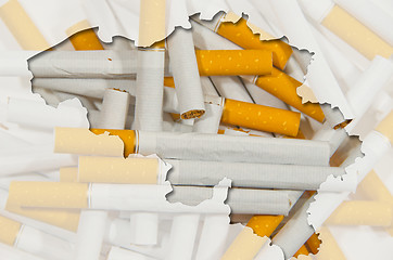 Image showing Outline map of Belgium with transparent cigarettes in background