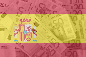 Image showing flag of Spain with transparent euro banknotes in background 