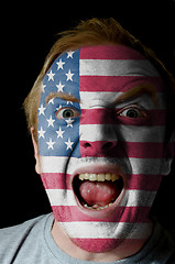 Image showing Face of crazy angry man painted in colors of american flag