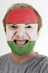 Image showing Face of crazy angry man painted in colors of hungary flag