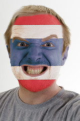 Image showing Face of crazy angry man painted in colors of Thailand flag