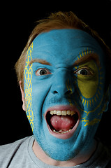 Image showing Face of crazy angry man painted in colors of kazakstan flag