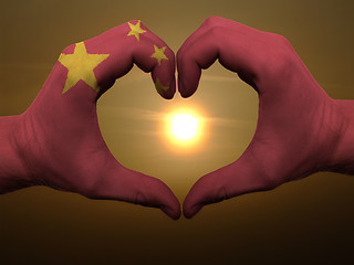 Image showing Heart and love gesture by hands colored in china flag during bea