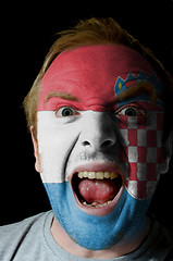 Image showing Face of crazy angry man painted in colors of Croatia flag