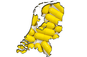 Image showing Outline map of Netherlands with pills in background