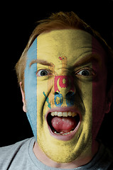 Image showing Face of crazy angry man painted in colors of moldova flag