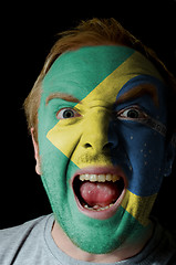 Image showing Face of crazy angry man painted in colors of Brazil flag