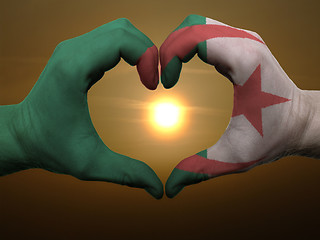 Image showing Heart and love gesture by hands colored in algeria flag during b