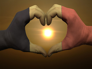 Image showing Heart and love gesture by hands colored in belgium flag during b