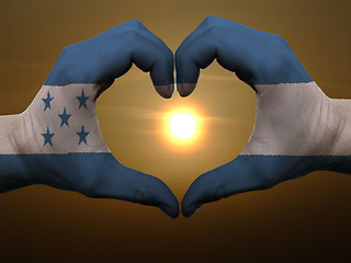 Image showing Heart and love gesture by hands colored in honduras flag during 