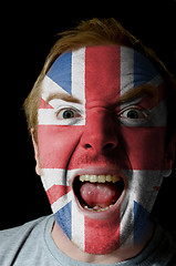 Image showing Face of crazy angry man painted in colors of uk flag