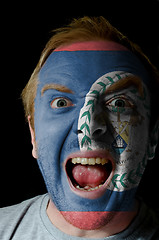 Image showing Face of crazy angry man painted in colors of Belize flag