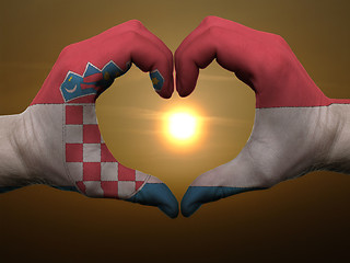 Image showing Heart and love gesture by hands colored in croatia flag during b