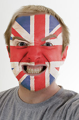 Image showing Face of crazy angry man painted in colors of uk flag