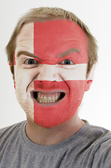 Image showing Face of crazy angry man painted in colors of denmark flag
