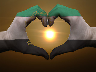 Image showing Heart and love gesture by hands colored in afghanistan flag duri