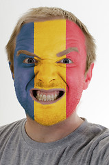 Image showing Face of crazy angry man painted in colors of romania flag