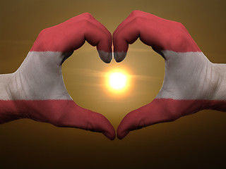 Image showing Heart and love gesture by hands colored in austria flag during b