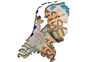 Image showing Outline map of Netherlands with euro banknotes in background 