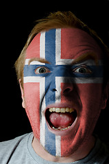 Image showing Face of crazy angry man painted in colors of norway flag